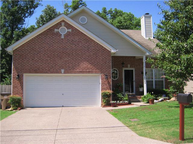 2824 Rader Ridge Court Antioch, TN 37013 - Photo 1 of 12 a front view of a house with yard and green space