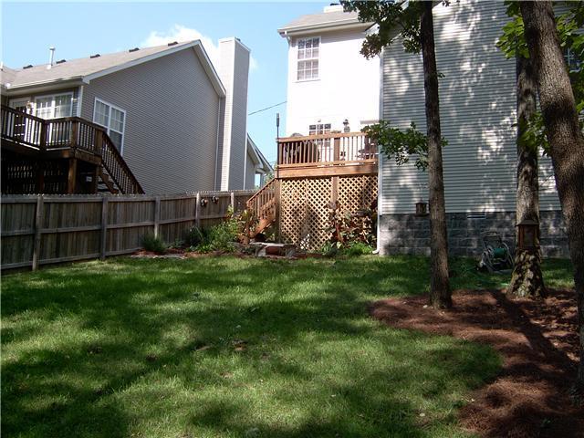 2824 Rader Ridge Court Antioch, TN 37013 - Photo 3 of 12 a view of backyard with brick wall and a chair