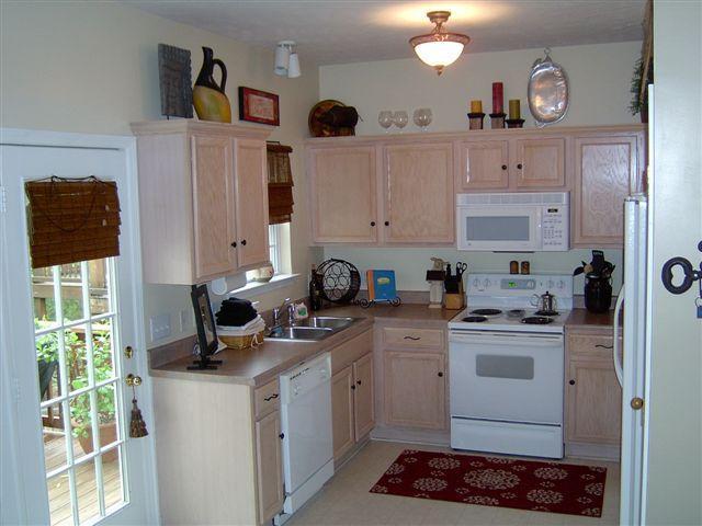2824 Rader Ridge Court Antioch, TN 37013 - Photo 9 of 12 a kitchen with a sink stove and cabinets
