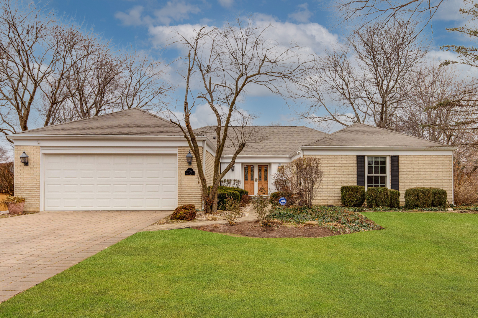 756 Stonegate Road Libertyville, IL 60048 - Photo 1 of 1 a front view of a house with garden