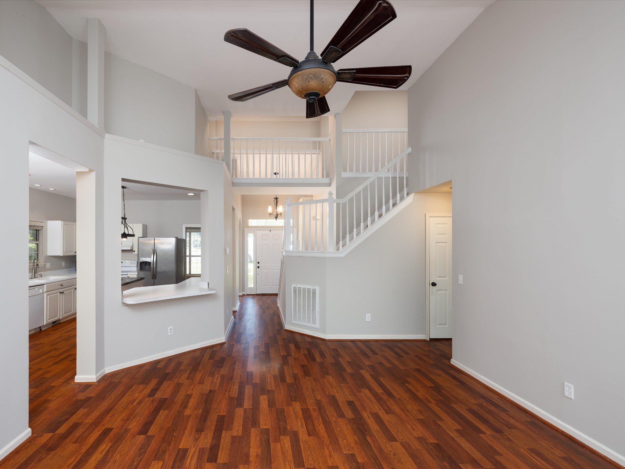4629 Sandy Creek Road Nashville, TN 37221 - Photo 8 of 48 a view of a livingroom with wooden floor and a ceiling fan