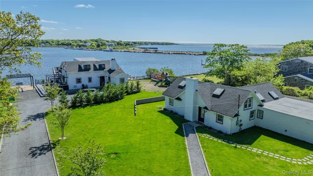 an aerial view of a house with swimming pool and garden