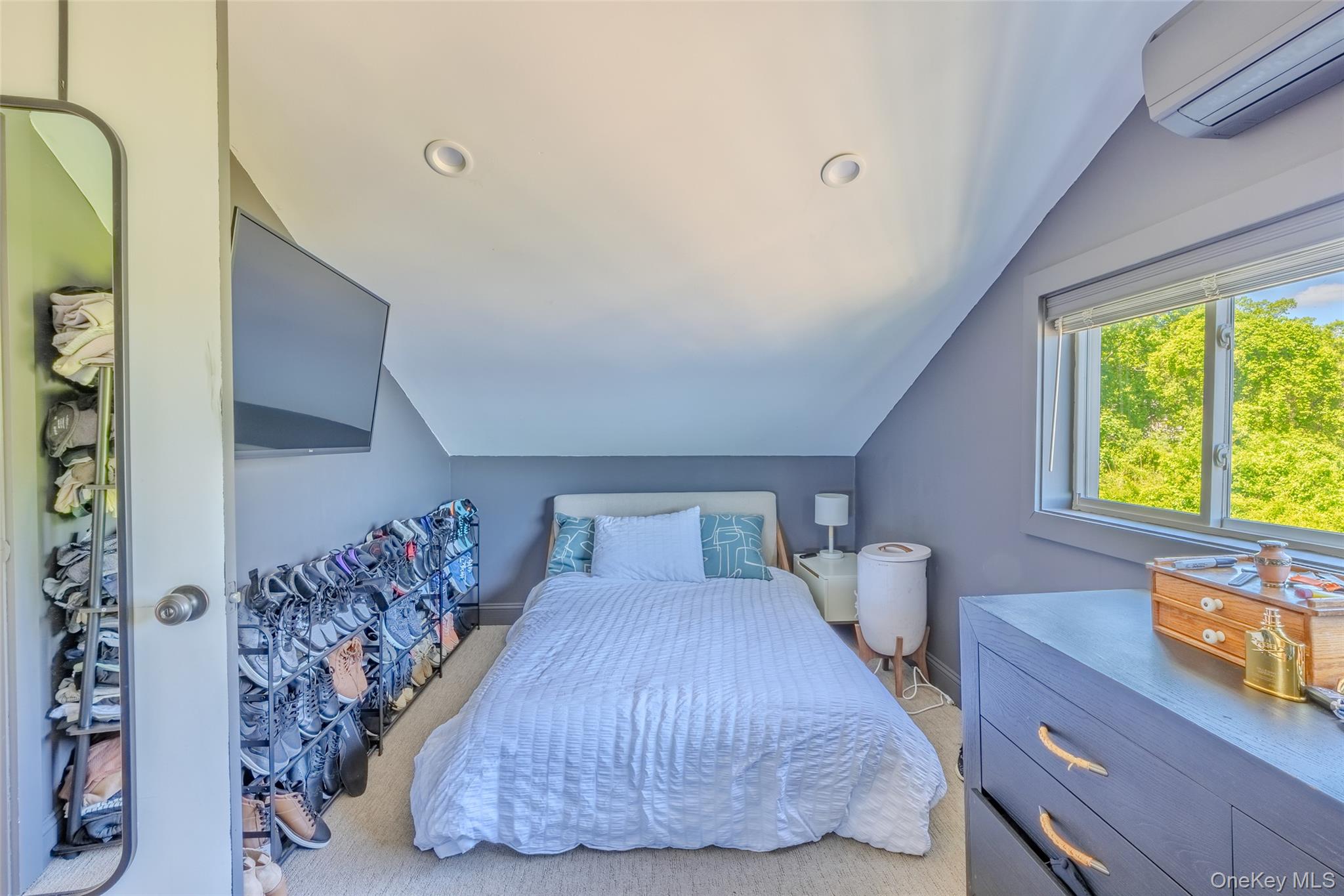 53 Old Neck Road South Center Moriches, NY 11934 - Photo 14 of 50 a bedroom with a bed and a window