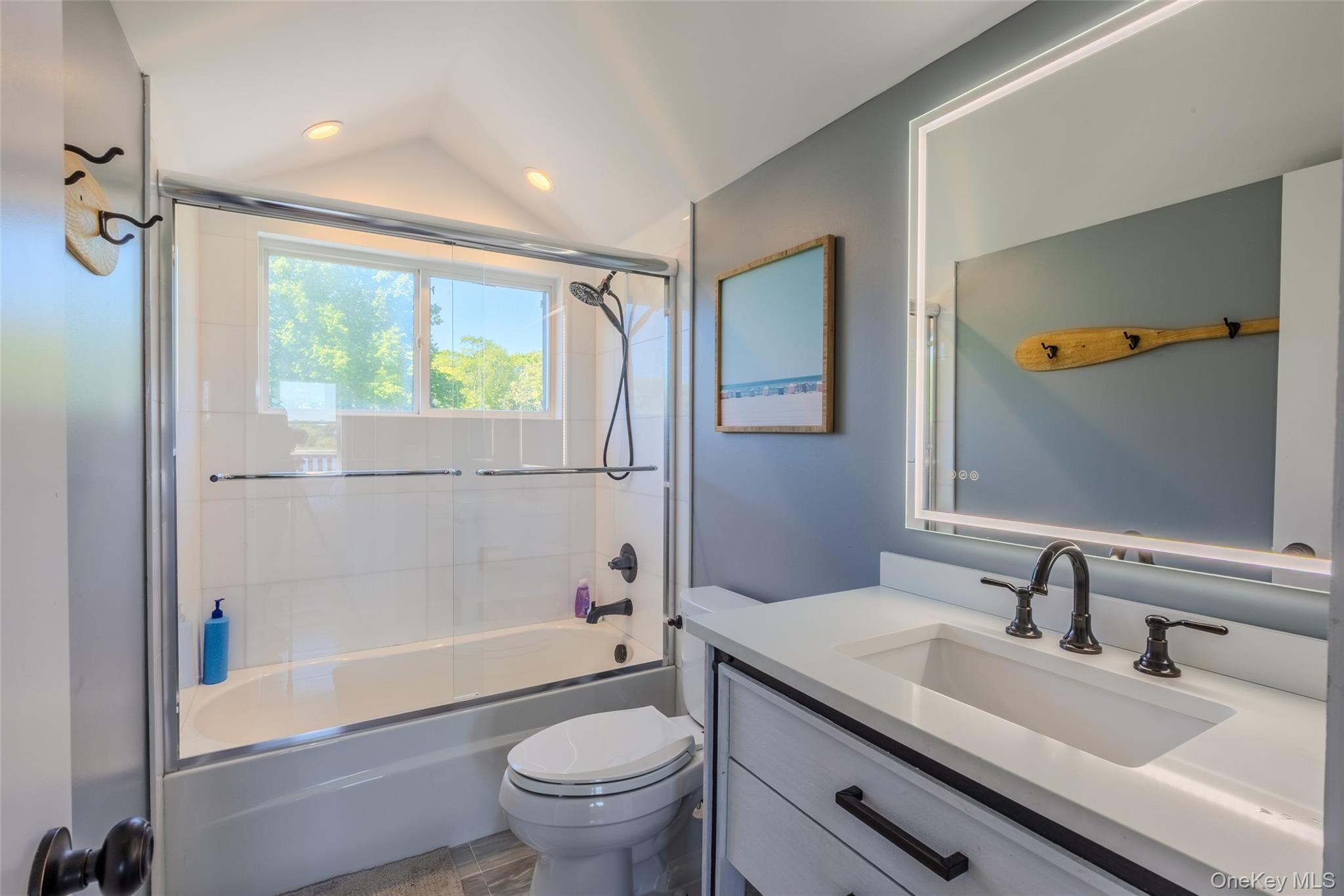 53 Old Neck Road South Center Moriches, NY 11934 - Photo 15 of 50 Bathroom with toilet, vanity, enclosed tub / shower combo, vaulted ceiling, and recessed lighting