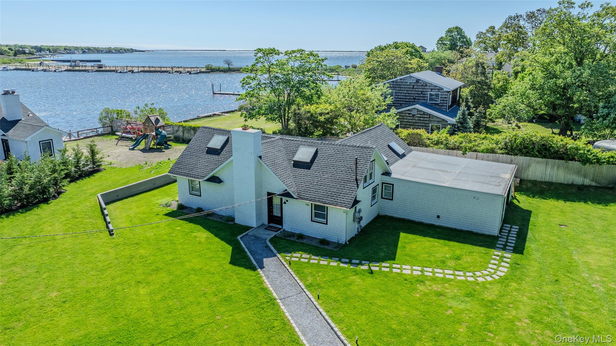 53 Old Neck Road South Center Moriches, NY 11934 - Photo 16 of 50 Aerial view of property and surrounding area featuring a large body of water