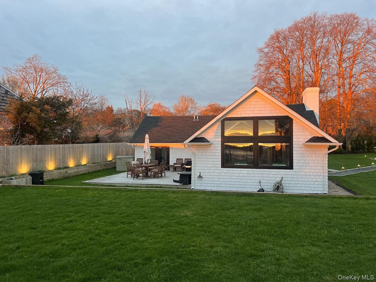 53 Old Neck Road South Center Moriches, NY 11934 - Photo 17 of 50 a front view of a house with garden