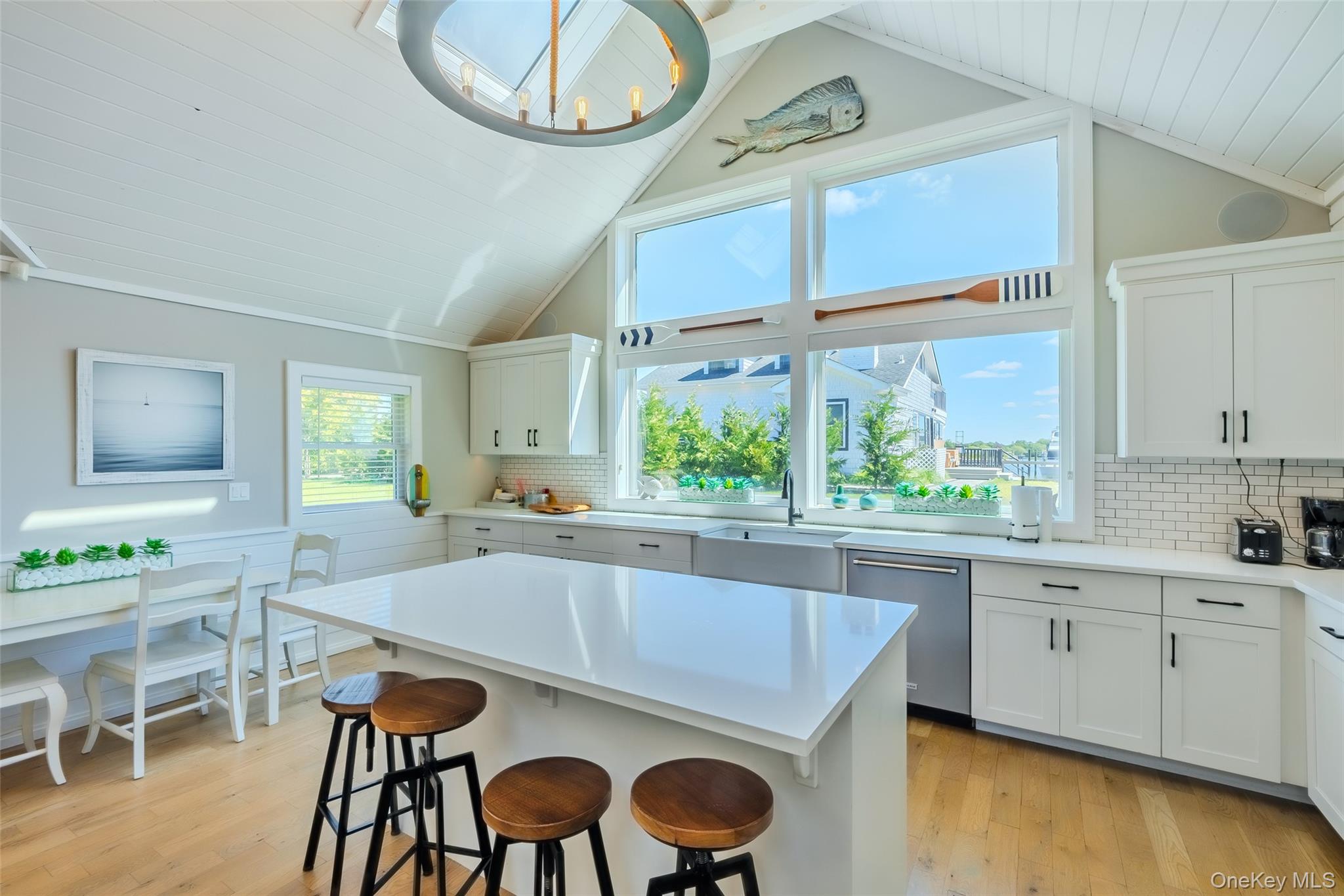 53 Old Neck Road South Center Moriches, NY 11934 - Photo 18 of 50 a kitchen with a table and chairs in it