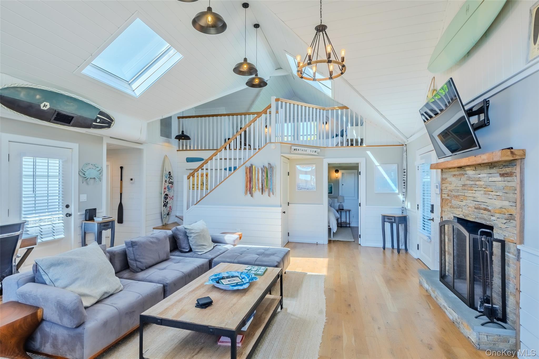 53 Old Neck Road South Center Moriches, NY 11934 - Photo 24 of 50 a living room with furniture and a fireplace