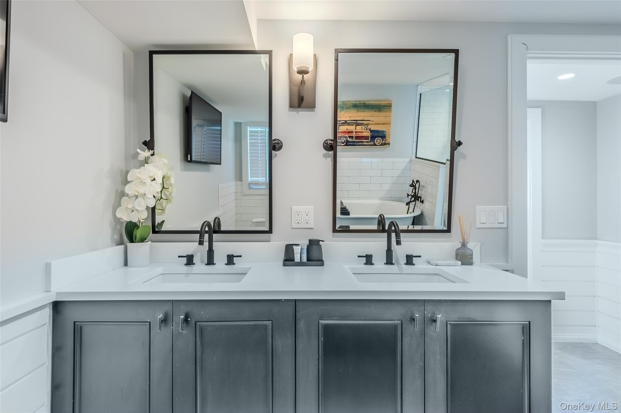 53 Old Neck Road South Center Moriches, NY 11934 - Photo 28 of 50 Bathroom featuring double vanity and a bathtub