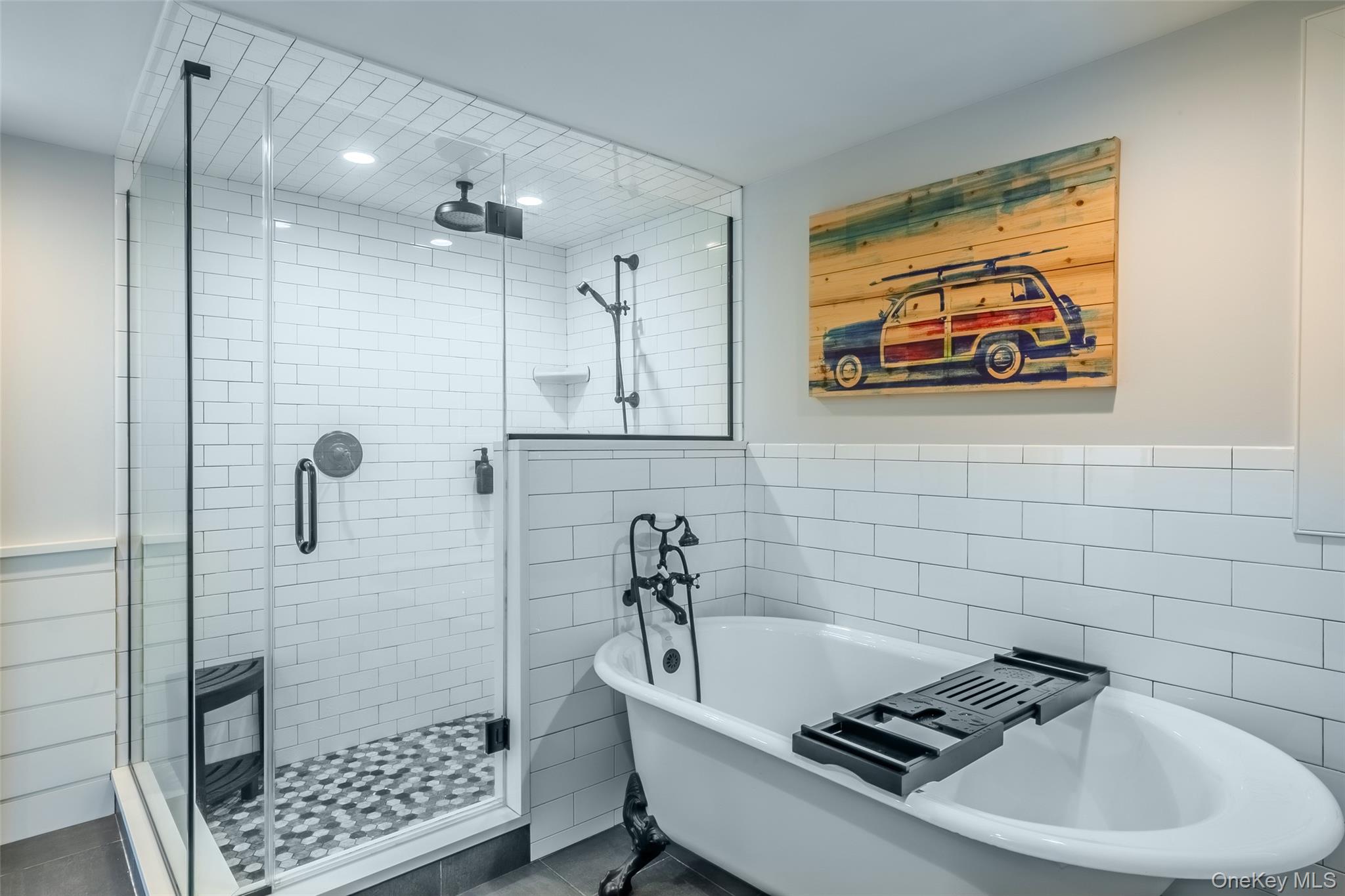 53 Old Neck Road South Center Moriches, NY 11934 - Photo 31 of 50 Bathroom with tile walls, a shower stall, a soaking tub, recessed lighting, and wainscoting