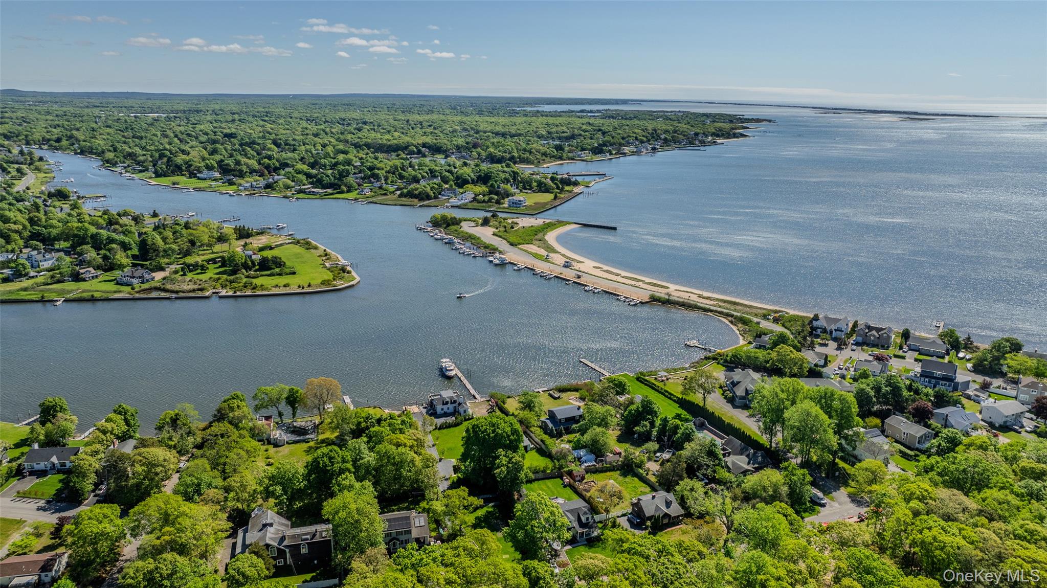 53 Old Neck Road South Center Moriches, NY 11934 - Photo 41 of 50 Bird's eye view of a nearby body of water and a heavily wooded area