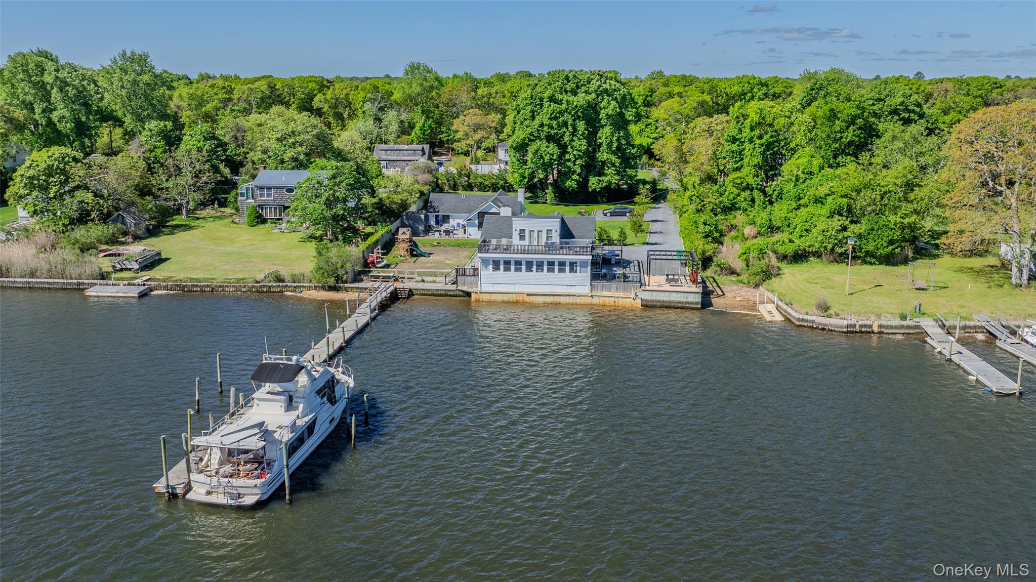 53 Old Neck Road South Center Moriches, NY 11934 - Photo 43 of 50 a view of a house with a yard