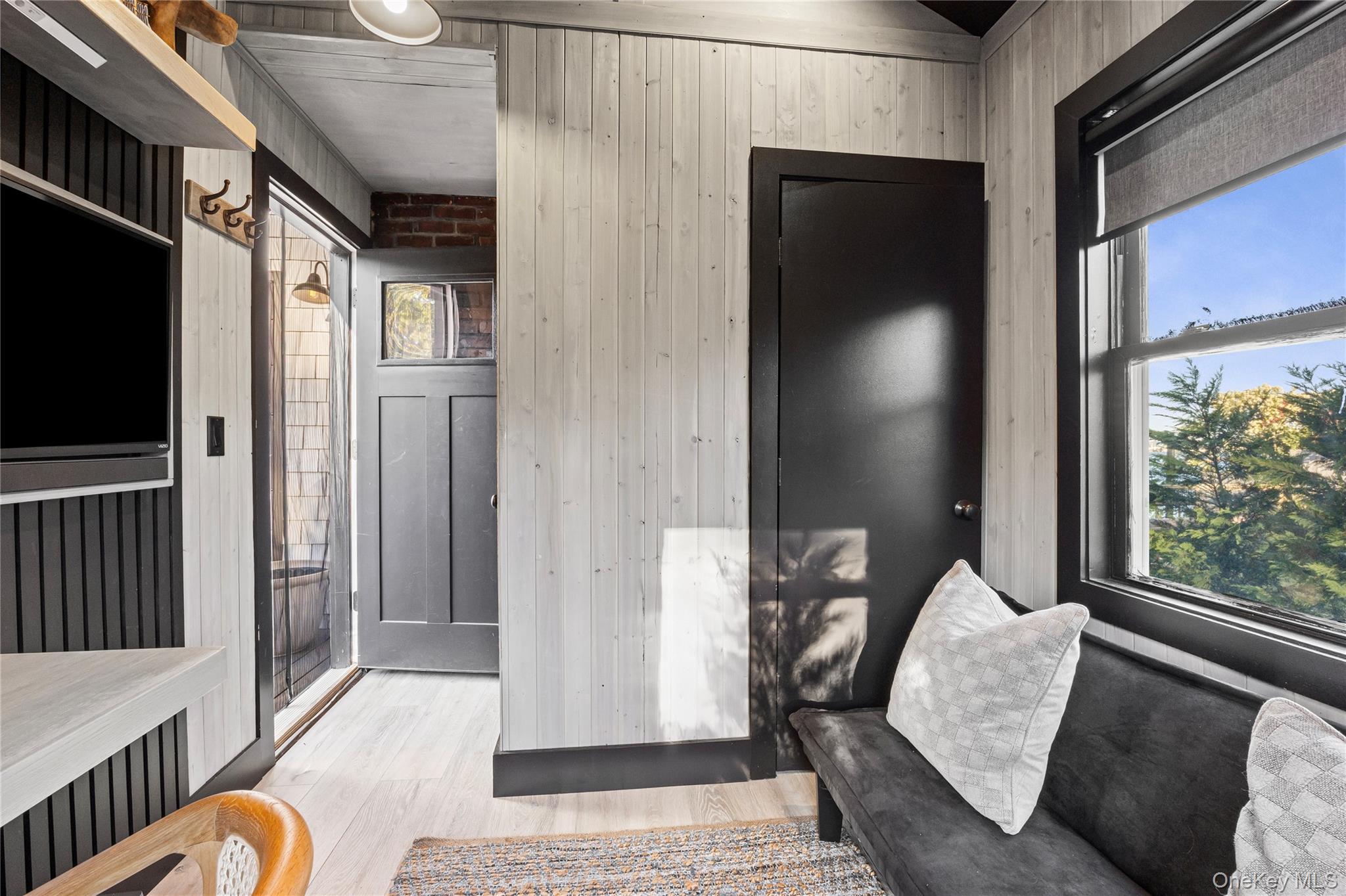 53 Old Neck Road South Center Moriches, NY 11934 - Photo 7 of 50 a balcony with furniture and a window