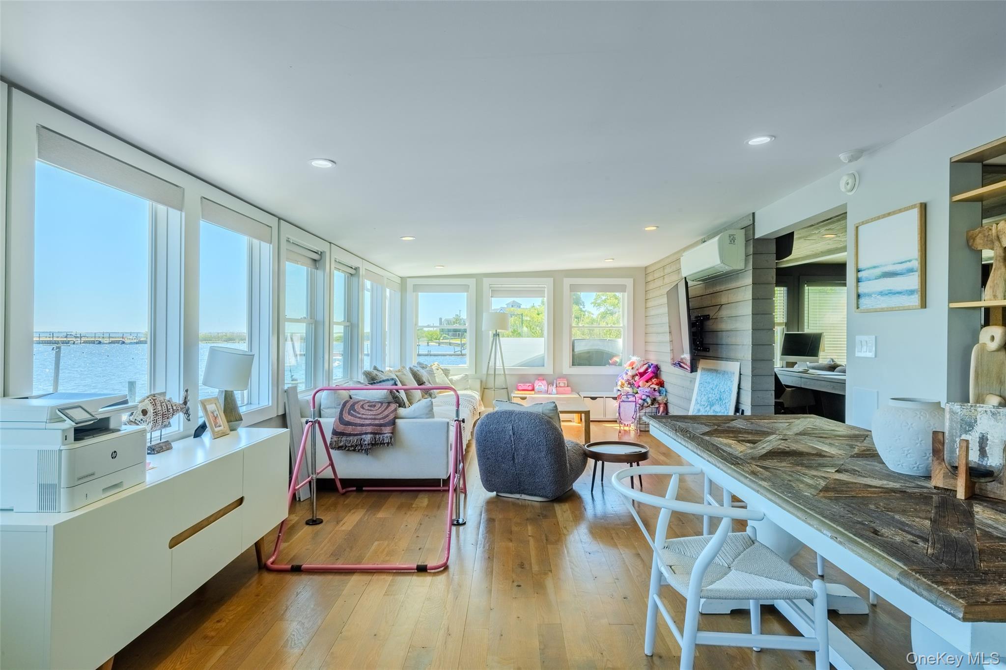 53 Old Neck Road South Center Moriches, NY 11934 - Photo 8 of 50 a living room with furniture and a large window