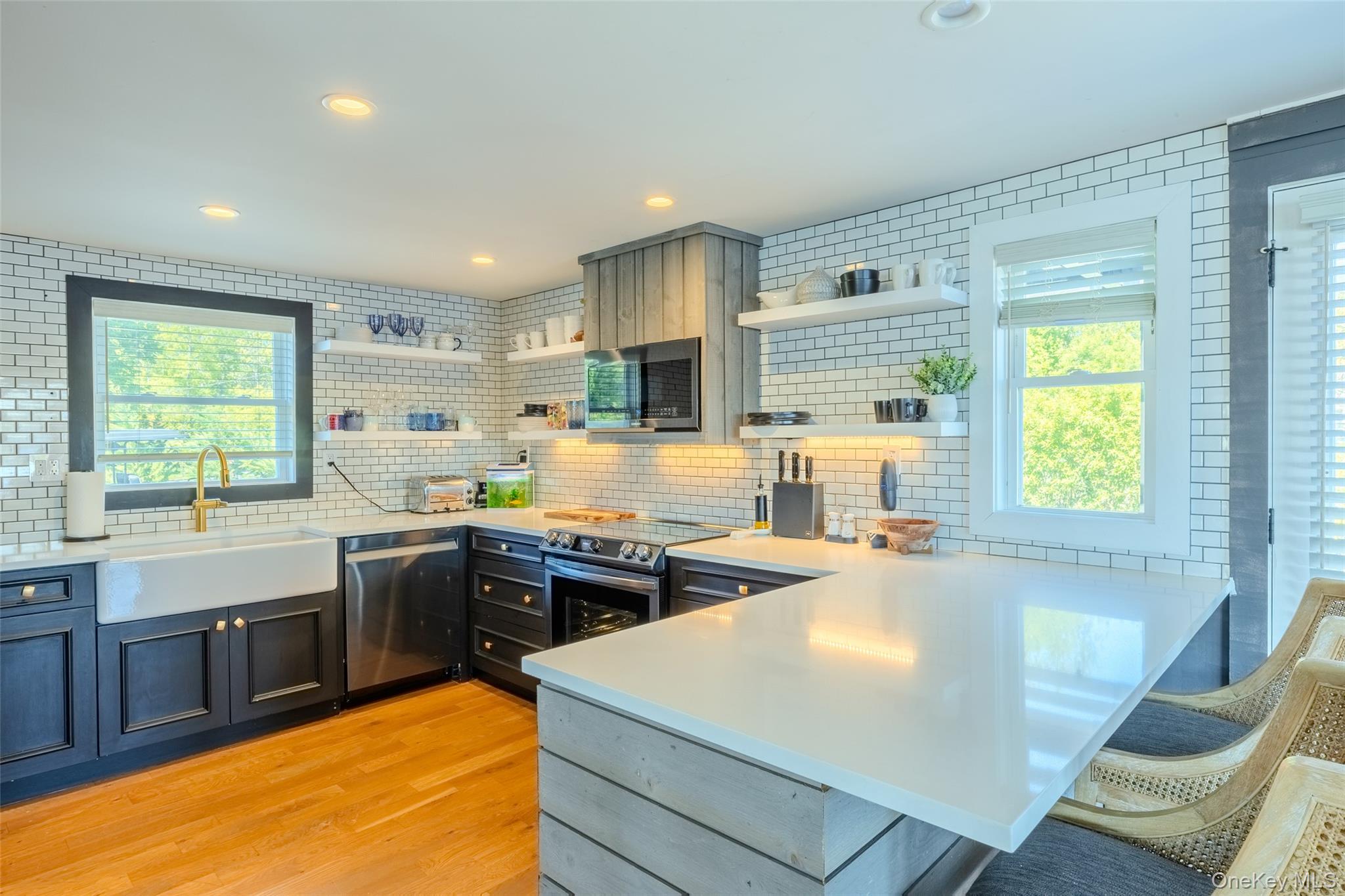 53 Old Neck Road South Center Moriches, NY 11934 - Photo 9 of 50 a kitchen with stainless steel appliances granite countertop a sink stove and refrigerator