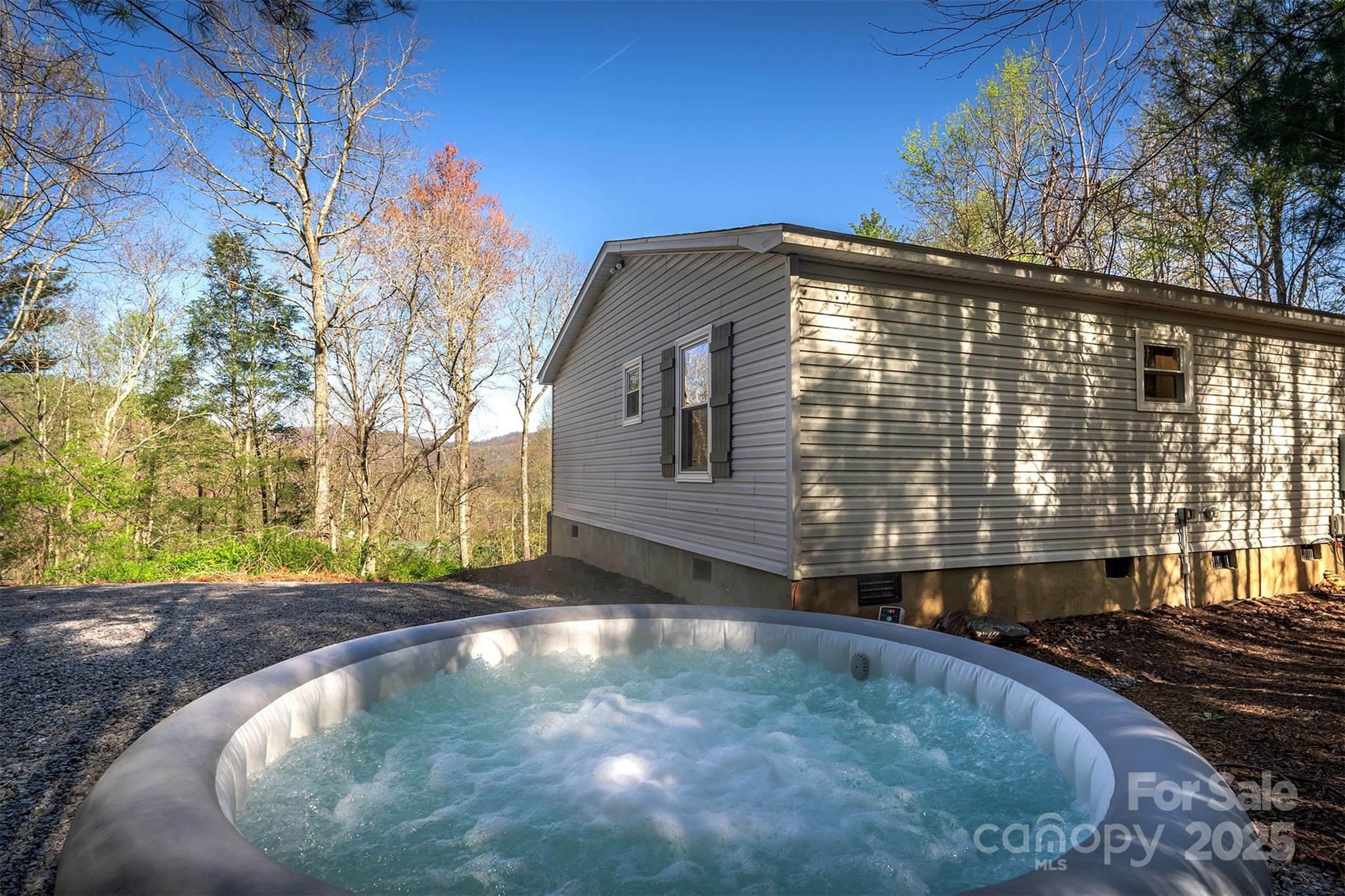 55 Whitaker Circle Fairview, NC 28730 - Photo 34 of 45 a view of a house with a backyard