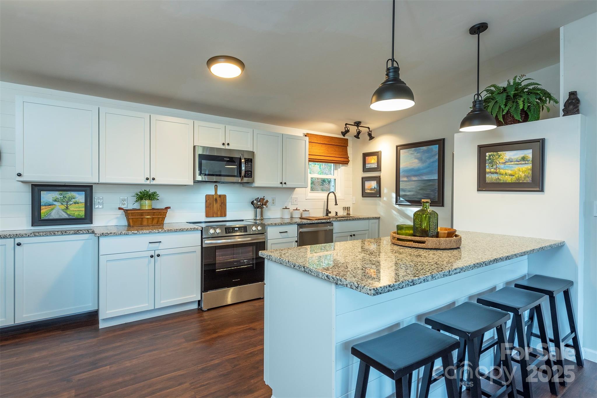 55 Whitaker Circle Fairview, NC 28730 - Photo 6 of 45 a kitchen with sink cabinets and wooden floor