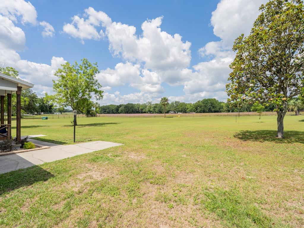4381 Northeast 105th Place Anthony, FL 32617 - Photo 38 of 49 a view of a lake with a house