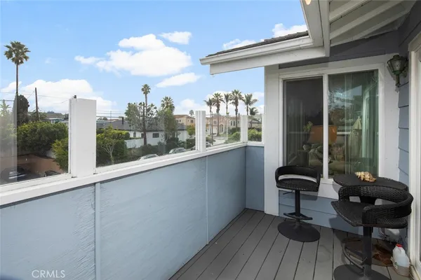a view of a chairs and table in patio of a house