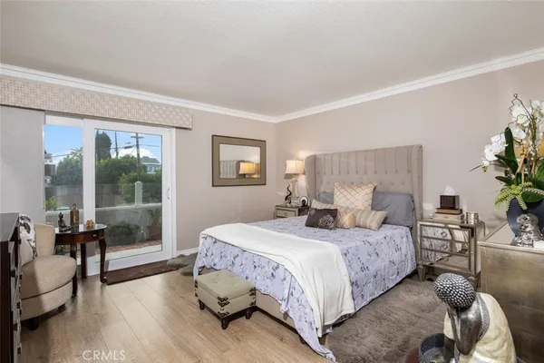 a bedroom with a bed and a couch