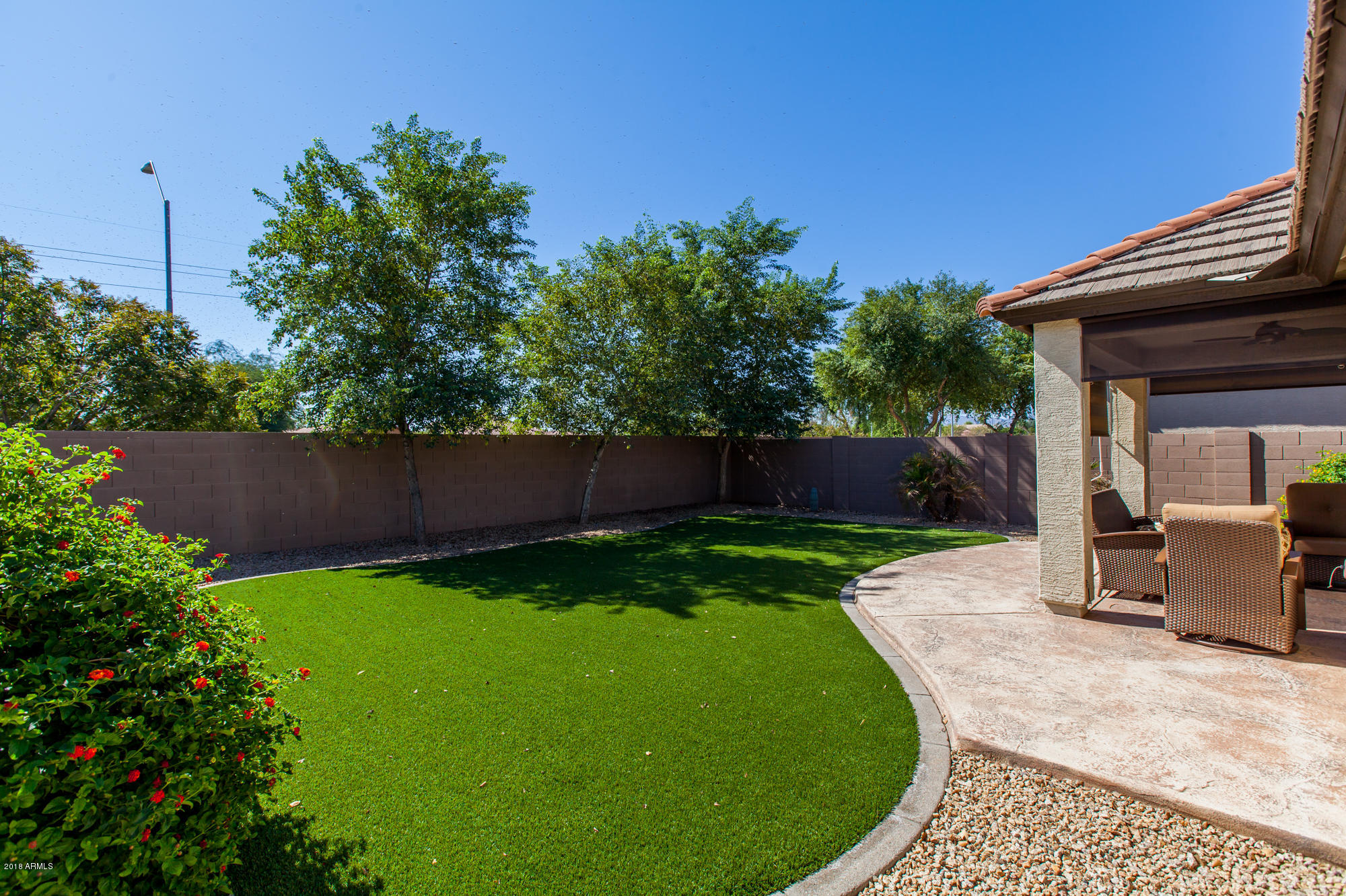 14837 West Wethersfield Road Surprise, AZ 85379 - Photo 29 of 31 artificial grass in back yard