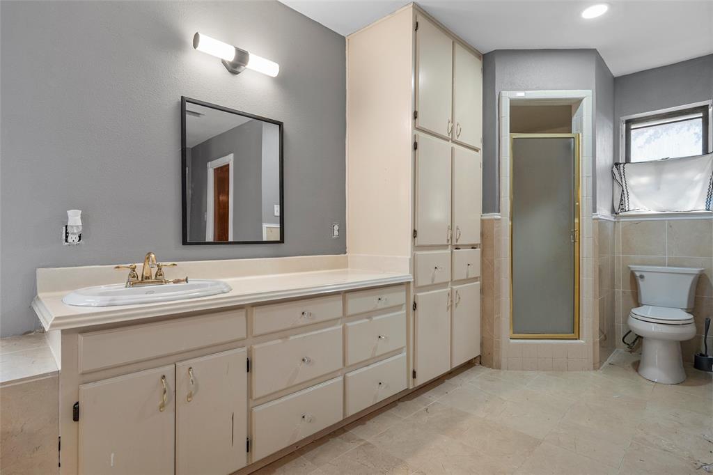 544 Lusk Creek Road Eddy, TX 76524 - Photo 16 of 39 Full bathroom with vanity, a stall shower, and tile walls