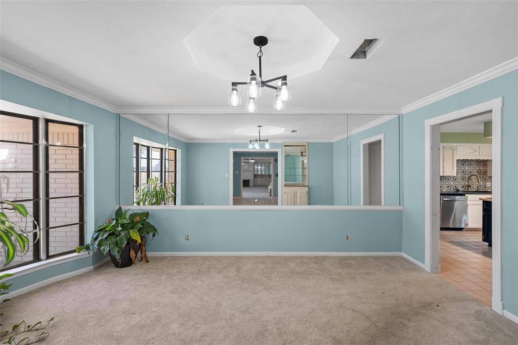 544 Lusk Creek Road Eddy, TX 76524 - Photo 2 of 39 Unfurnished living room with carpet flooring, ornamental molding, and a chandelier