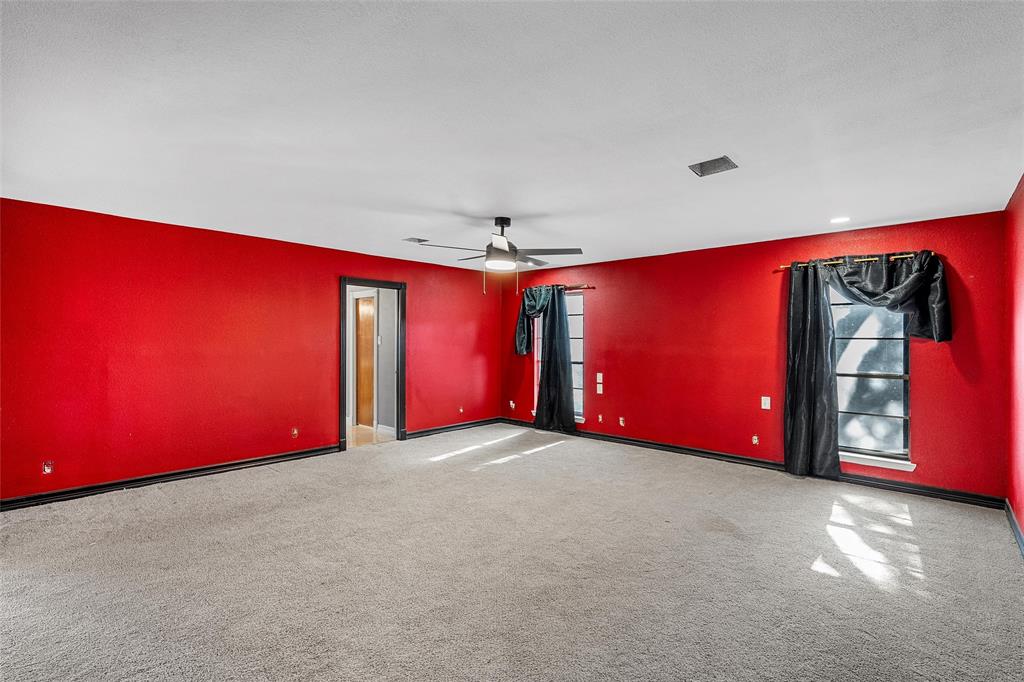 544 Lusk Creek Road Eddy, TX 76524 - Photo 22 of 39 Carpeted empty room with ceiling fan and plenty of natural light