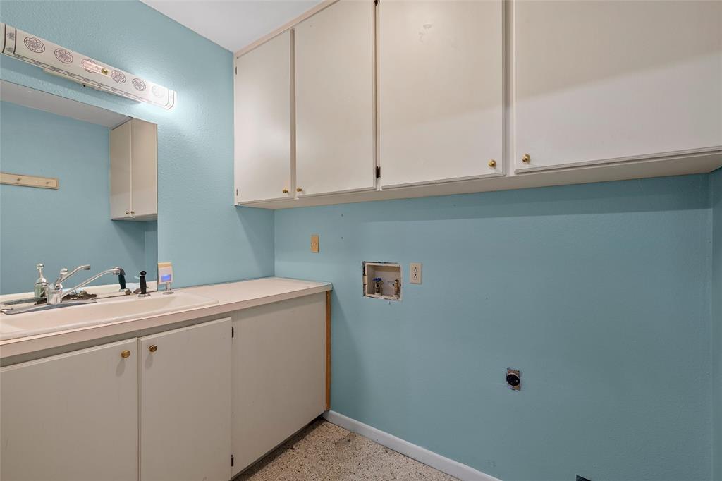 544 Lusk Creek Road Eddy, TX 76524 - Photo 23 of 39 Laundry area featuring hookup for a washing machine, cabinet space, and dark aggregate flooring