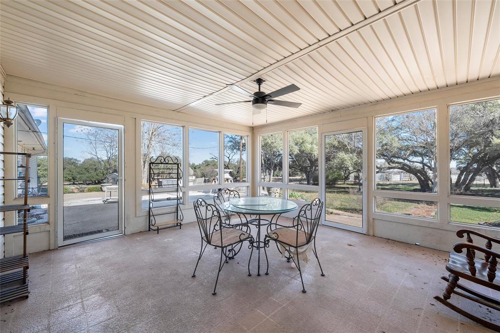 544 Lusk Creek Road Eddy, TX 76524 - Photo 29 of 39 Sunroom / solarium featuring a ceiling fan, outdoor dining area, and plenty of natural light
