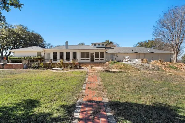 a view of a lake with a house in the background