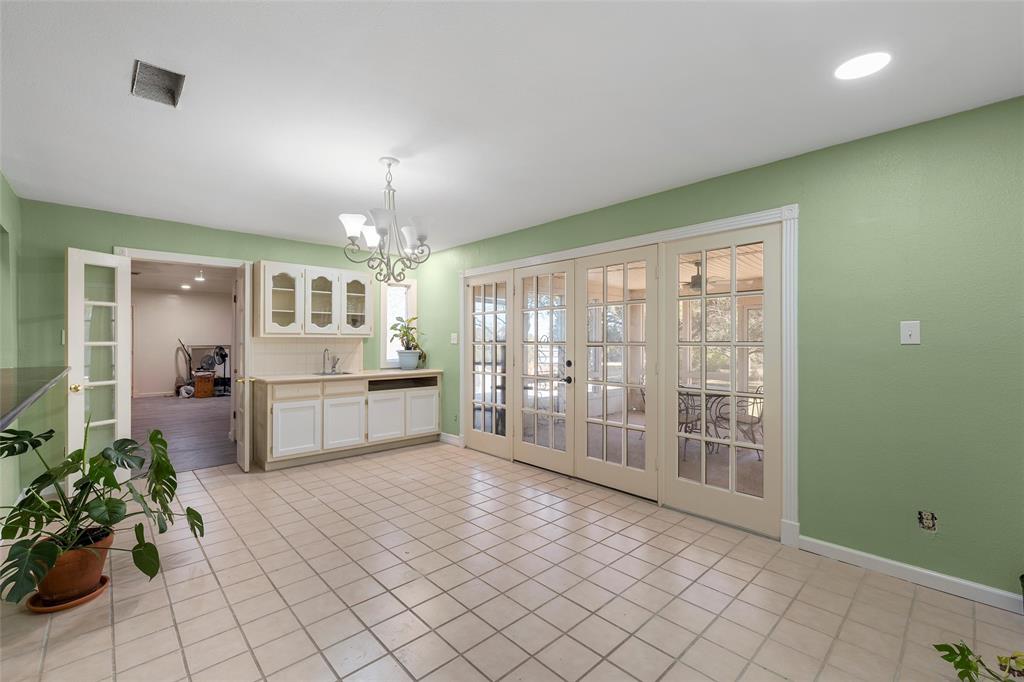 544 Lusk Creek Road Eddy, TX 76524 - Photo 7 of 39 Unfurnished dining area featuring french doors, light tile patterned flooring, a chandelier, and recessed lighting