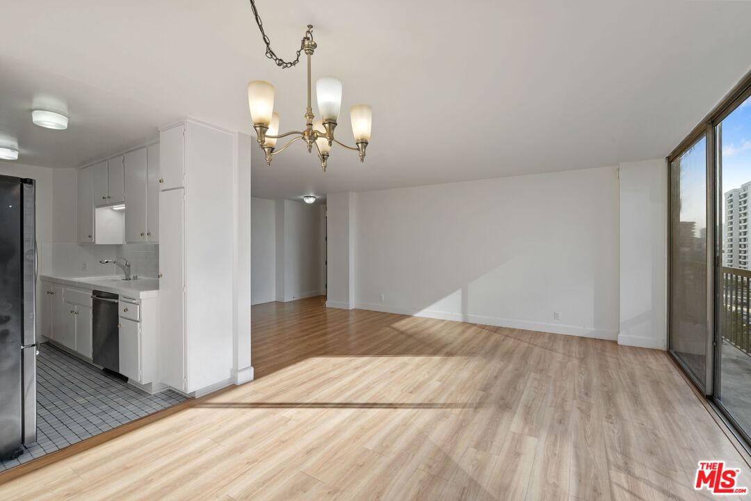 10747 Wilshire Boulevard, Unit 701 Los Angeles, CA 90024 - Photo 2 of 14 a view of a livingroom with a chandelier