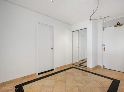 a view of a room with drop ceiling fan
