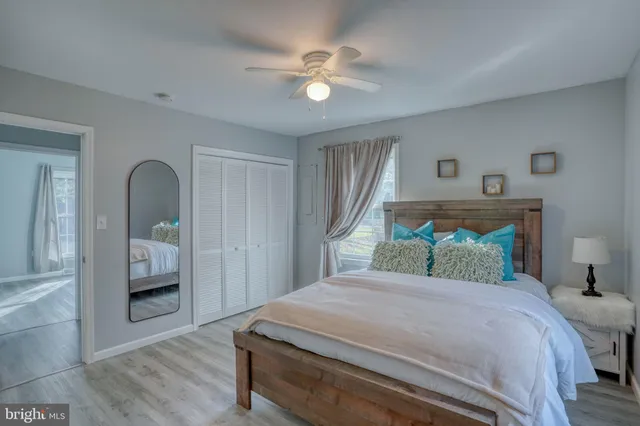 a bedroom with a large bed and a window