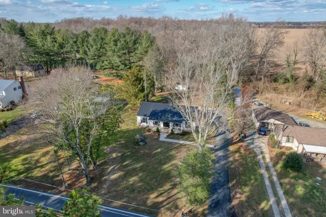 a aerial view of a house with a yard