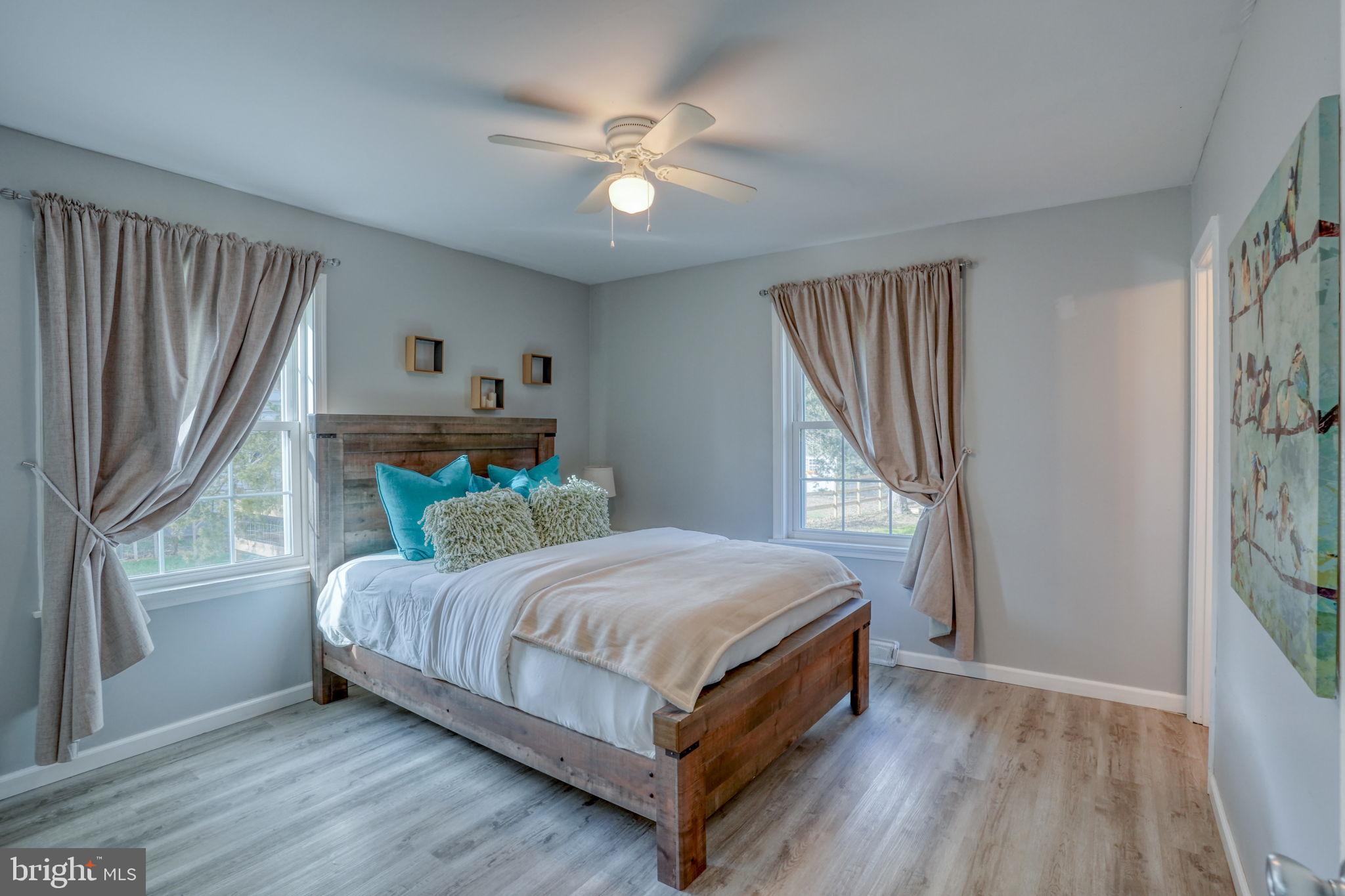 1549 Persimmon Tree Lane Dover, DE 19901 - Photo 4 of 25 a bedroom with a bed and a window