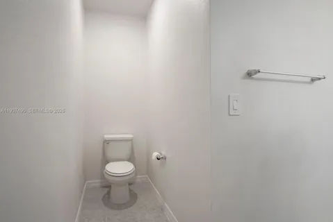 a bathroom with a toilet and a vanity