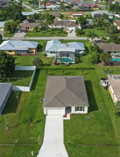 an aerial view of a house with a garden