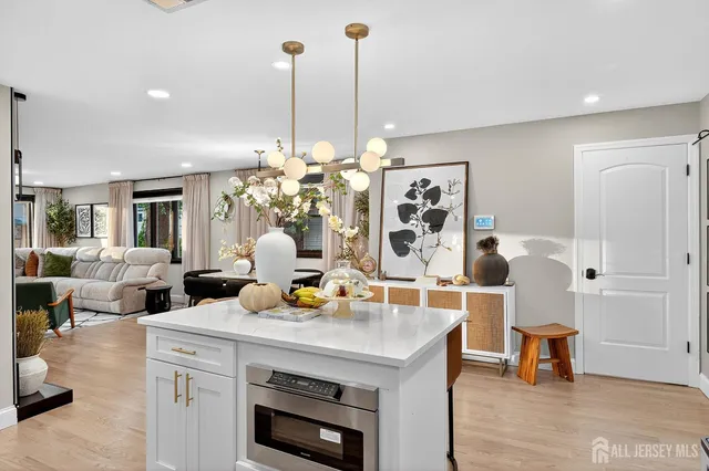 a view of living room with furniture and wooden floor