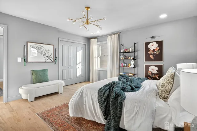 a bedroom with a bed and furniture