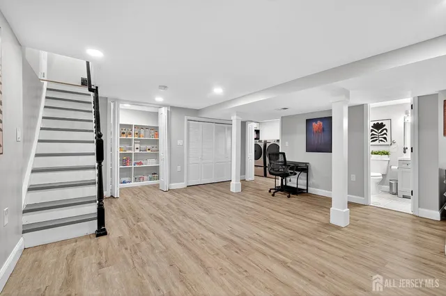 a bed room with furniture and a wooden floor