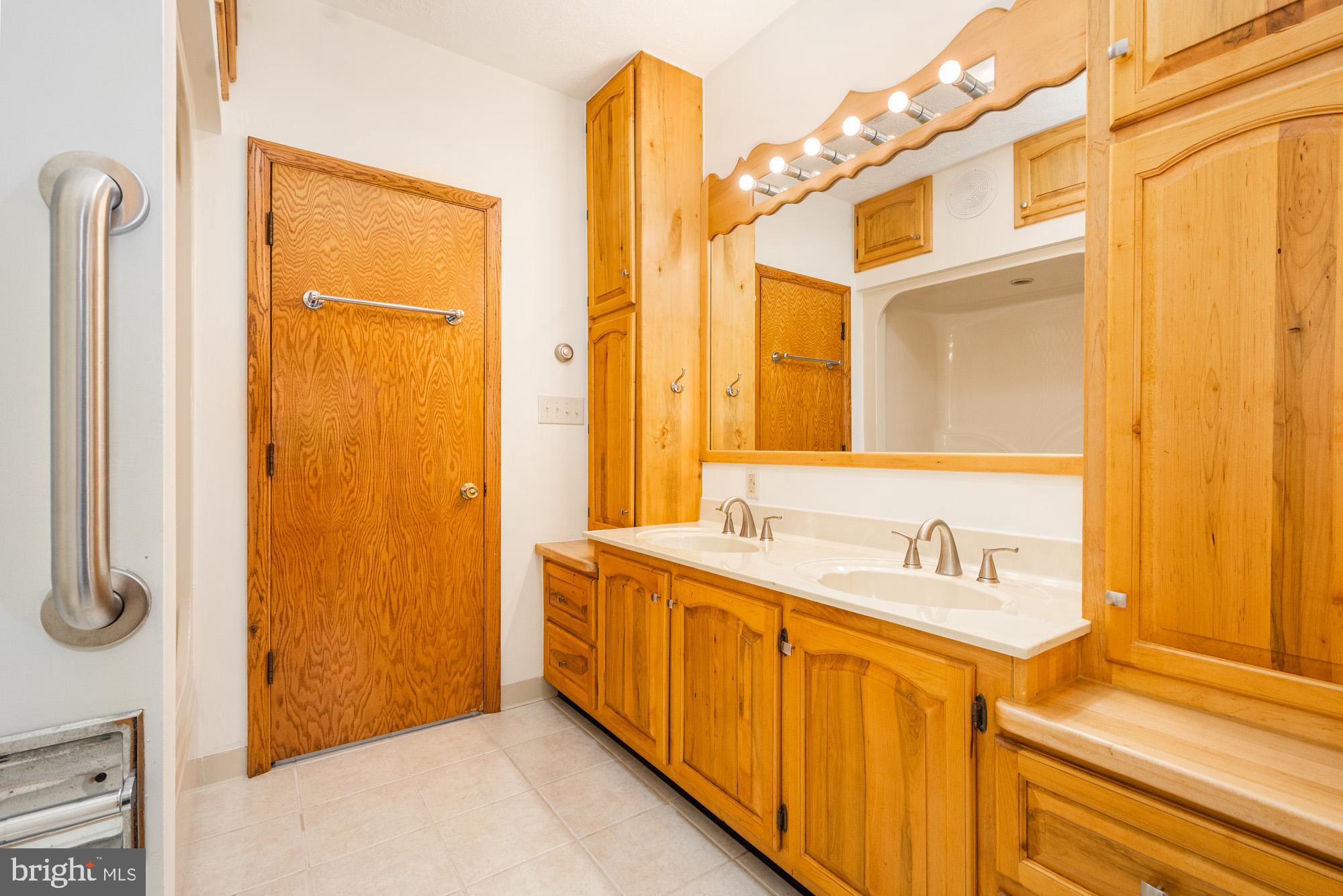 4007 White Rock Road Friendsville, MD 21531 - Photo 24 of 39 a bathroom with a sink and a mirror