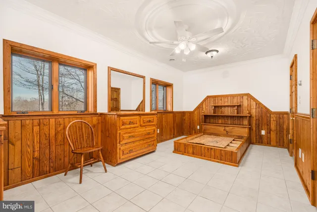 a bedroom with furniture and window