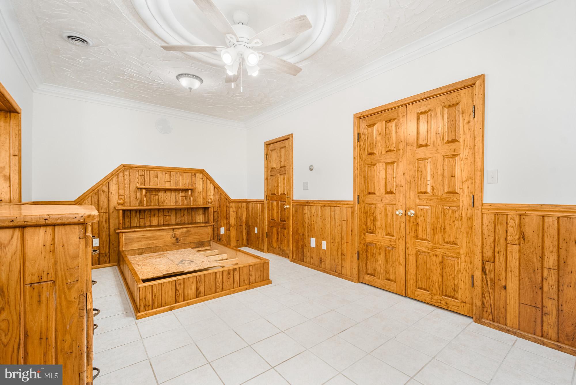 4007 White Rock Road Friendsville, MD 21531 - Photo 28 of 39 a bedroom with a bed and a chandelier