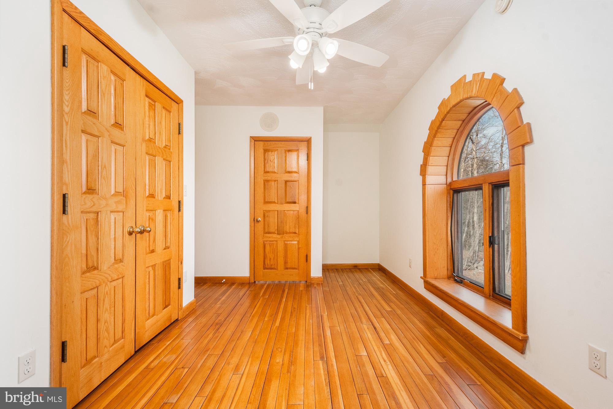 4007 White Rock Road Friendsville, MD 21531 - Photo 33 of 39 wooden floor in an empty room with a window