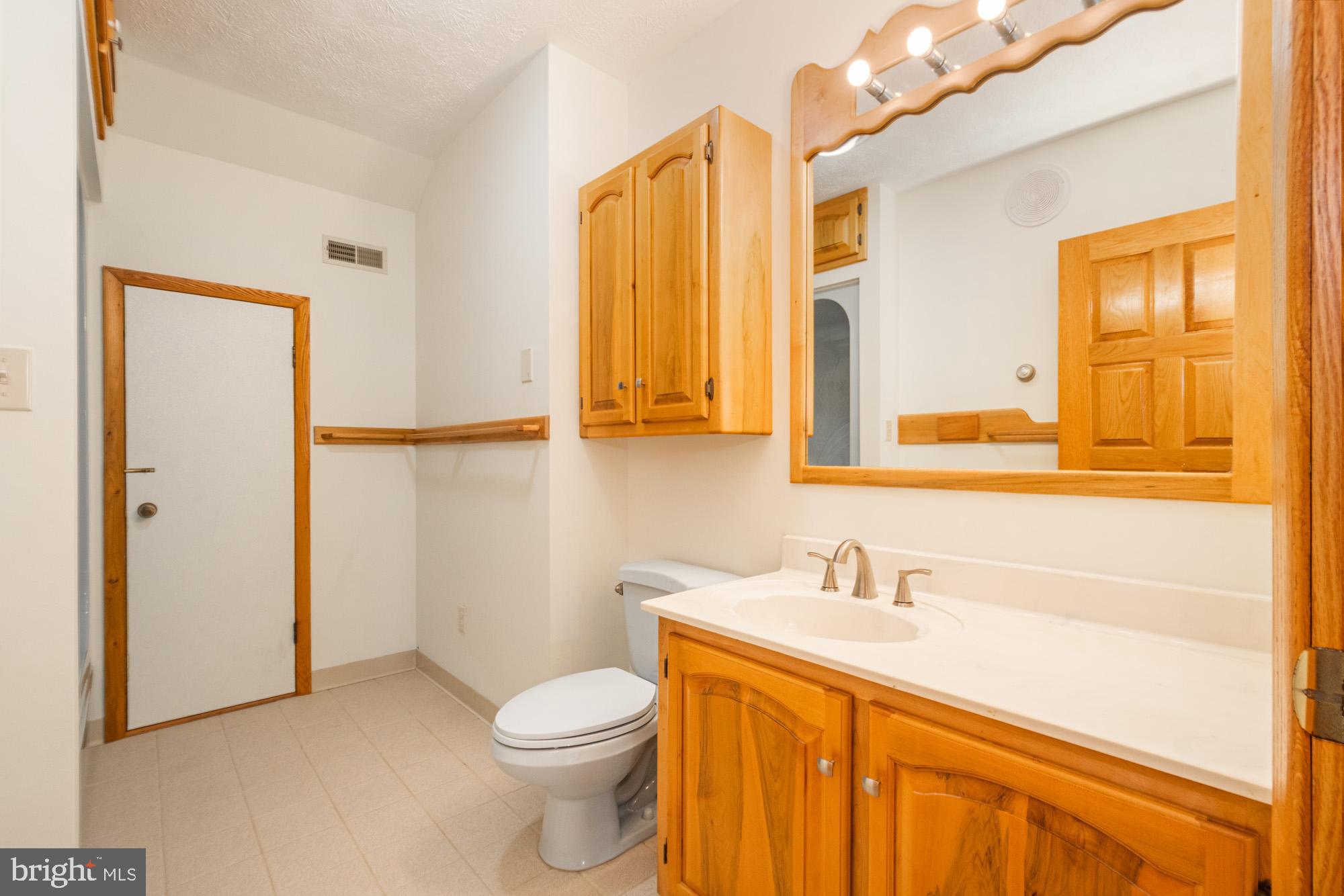 4007 White Rock Road Friendsville, MD 21531 - Photo 34 of 39 a bathroom with a sink a toilet and shower