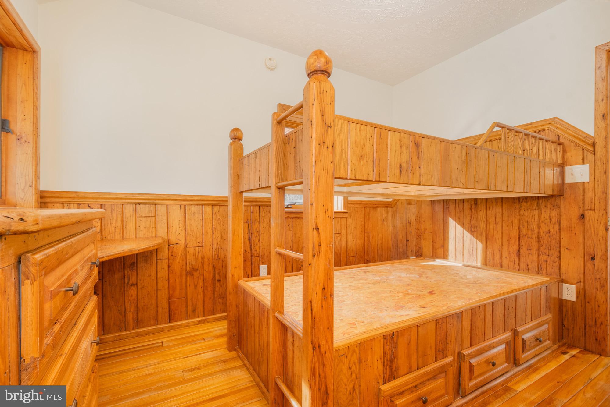 4007 White Rock Road Friendsville, MD 21531 - Photo 37 of 39 a bedroom with a bed and wooden floor