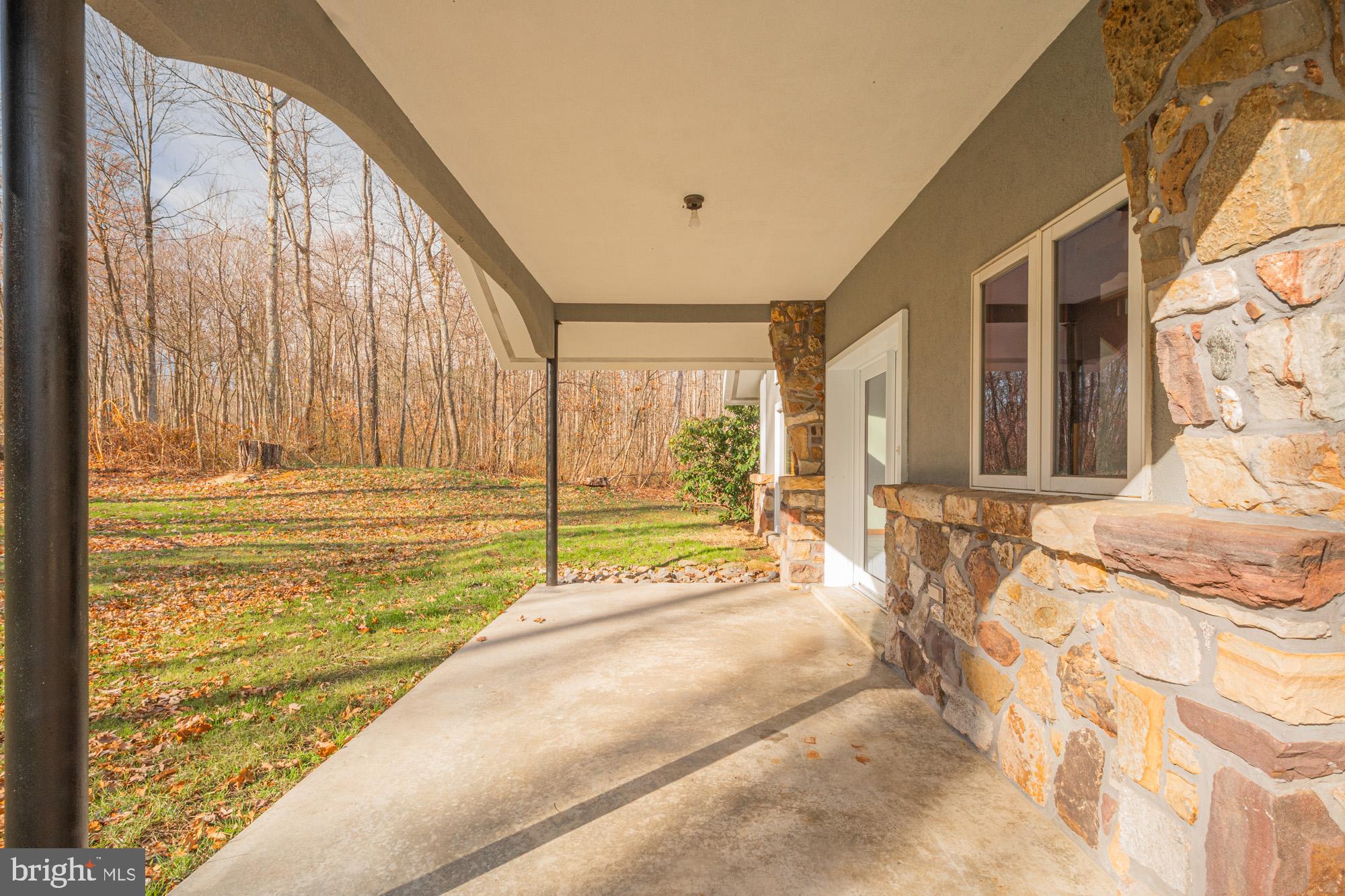 4007 White Rock Road Friendsville, MD 21531 - Photo 8 of 39 a view of a bedroom with a bed and large window