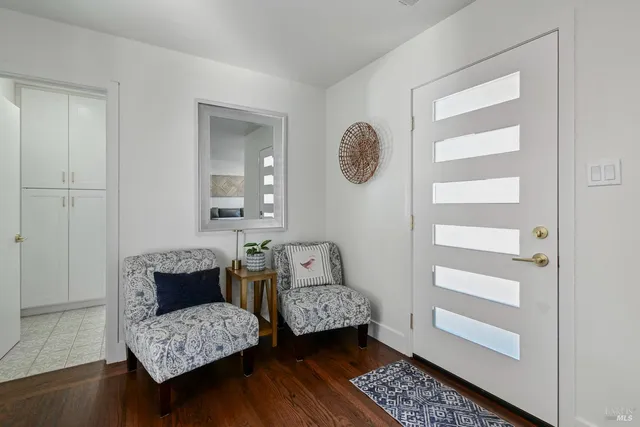 a room with two beds and a table